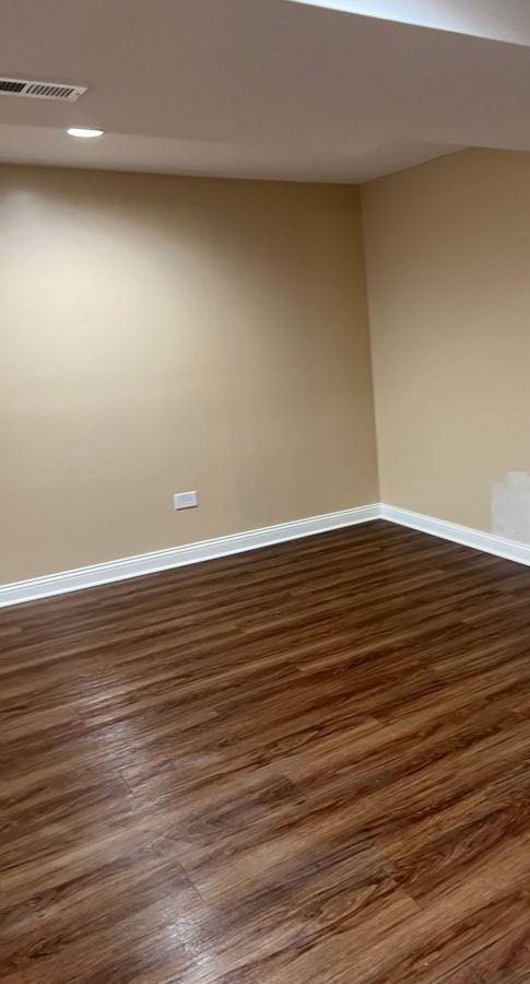 Finished basement: new plank floor in a finished basement