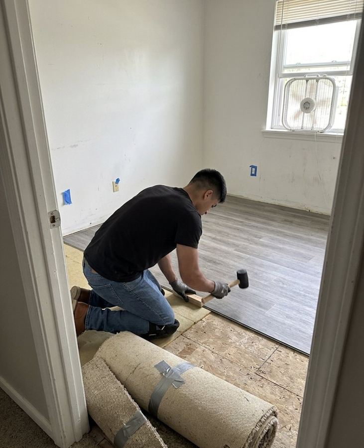 On the job: tapping planks into place